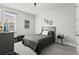 Stylish bedroom with a cozy bed, guitar, sleek furniture, and decor at 14004 Gullstrand Ave, Orlando, FL 32827