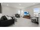 Upstairs bonus room with comfortable seating, a desk area, and a TV for entertainment at 14004 Gullstrand Ave, Orlando, FL 32827