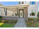 Inviting front entrance with stone accents, covered porch, and well-maintained landscaping at 14004 Gullstrand Ave, Orlando, FL 32827