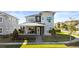 Stunning two-story home with modern design, landscaping, and welcoming front porch at 14004 Gullstrand Ave, Orlando, FL 32827