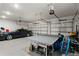Spacious garage featuring ample storage, a car, and ping pong table at 14004 Gullstrand Ave, Orlando, FL 32827