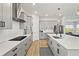 Contemporary kitchen featuring sleek gray cabinets, stainless steel appliances, and ample counter space at 14004 Gullstrand Ave, Orlando, FL 32827