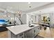 Bright kitchen with a large island, stainless steel appliances, and a view of the dining area and backyard at 14004 Gullstrand Ave, Orlando, FL 32827