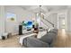 Cozy living room with large windows, a comfortable sofa, and an entertainment center with a flat-screen TV at 14004 Gullstrand Ave, Orlando, FL 32827