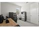 Bright office features a large desk, storage cabinets, and natural light from the window at 14004 Gullstrand Ave, Orlando, FL 32827