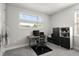 Bright home office featuring modern desk, sleek black furnishings, and window letting in natural light at 14004 Gullstrand Ave, Orlando, FL 32827