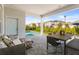Inviting outdoor patio with comfortable seating, dining area, and pool views at 14004 Gullstrand Ave, Orlando, FL 32827