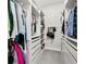Spacious walk-in closet with organized shelving, drawers, and ample hanging space at 14004 Gullstrand Ave, Orlando, FL 32827