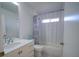 Cozy bathroom featuring a bathtub, a shower curtain, and modern vanity at 14901 Wild Wood Lily Ct, Orlando, FL 32824