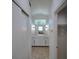 Bright bathroom featuring double sinks, white cabinets and long mirror at 14901 Wild Wood Lily Ct, Orlando, FL 32824