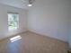 Minimalist bedroom with tile floor and large window at 14901 Wild Wood Lily Ct, Orlando, FL 32824