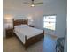 Bright bedroom with a ceiling fan, neutral walls, and window view to exterior at 14901 Wild Wood Lily Ct, Orlando, FL 32824