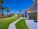 Charming home displaying mature landscaping, lush green lawn, and a inviting entrance pathway at 14901 Wild Wood Lily Ct, Orlando, FL 32824