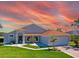 Charming single-story home featuring a well-manicured lawn and inviting entrance at 14901 Wild Wood Lily Ct, Orlando, FL 32824