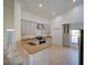 Bright kitchen featuring modern appliances, stylish countertops, ample storage, and a breakfast bar seating at 14901 Wild Wood Lily Ct, Orlando, FL 32824