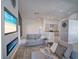 Open concept living space featuring a modern fireplace and seamless flow to the kitchen at 14901 Wild Wood Lily Ct, Orlando, FL 32824