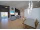Bright living room with modern lighting, tile floors, and a sleek fireplace feature at 14901 Wild Wood Lily Ct, Orlando, FL 32824