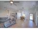 Spacious open-concept living area with dining, tile floors, and a view of the kitchen at 14901 Wild Wood Lily Ct, Orlando, FL 32824