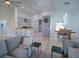 Open floor plan living space with view to kitchen, stylish decor, and ample natural light at 14901 Wild Wood Lily Ct, Orlando, FL 32824