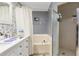 Bathroom with a combination bathtub and shower featuring updated fixtures and a stylish shower screen at 1562 Woodwind Dr, Apopka, FL 32703