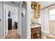 Cozy bathroom featuring a glass bowl sink, a mirrored medicine cabinet and a shower with curtain at 1562 Woodwind Dr, Apopka, FL 32703
