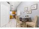 View of eat-in kitchen showing breakfast table and chairs in the foreground at 1562 Woodwind Dr, Apopka, FL 32703