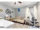 Bright room with a sofa, computer desk, and modern home gym equipment at 1562 Woodwind Dr, Apopka, FL 32703