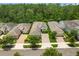 Aerial view of the homes with well-maintained landscaping and lawns at 1686 Victoria Gardens Dr, Deland, FL 32724