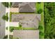 An aerial top down shot of houses with neatly manicured lawns and driveways at 1686 Victoria Gardens Dr, Deland, FL 32724