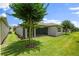 Spacious backyard with lush lawn and mature tree at 1686 Victoria Gardens Dr, Deland, FL 32724