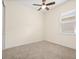Cozy bedroom with neutral carpet, ceiling fan, window with blinds, and ample natural light at 1686 Victoria Gardens Dr, Deland, FL 32724
