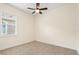 Bedroom with ceramic floors, ceiling fan, and a window with blinds offering lots of natural light at 1686 Victoria Gardens Dr, Deland, FL 32724