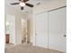 Bright bedroom with ceiling fan, double closets and ensuite bathroom ready for relaxation at 1686 Victoria Gardens Dr, Deland, FL 32724