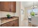 Functional butler's pantry features extra storage and counter space, conveniently located near the dining area at 1686 Victoria Gardens Dr, Deland, FL 32724