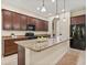 Modern kitchen boasts granite countertops, stainless steel appliances, and ample cabinet space at 1686 Victoria Gardens Dr, Deland, FL 32724