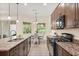 This spacious kitchen has granite countertops and a breakfast nook with views of the backyard at 1686 Victoria Gardens Dr, Deland, FL 32724