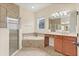 A relaxing main bathroom has a soaking tub, separate shower, and dual vanity sinks at 1686 Victoria Gardens Dr, Deland, FL 32724