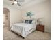Relax in this main bedroom, featuring a tray ceiling, neutral decor, and ample natural light at 1686 Victoria Gardens Dr, Deland, FL 32724