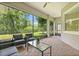 Enjoy outdoor living on this screened lanai with brick flooring and seating at 1686 Victoria Gardens Dr, Deland, FL 32724