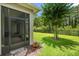 View of the screened patio from the backyard at 1686 Victoria Gardens Dr, Deland, FL 32724