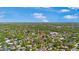 An aerial view of the property in a lush neighborhood with mature trees at 1701 Palmer Ave, Winter Park, FL 32789