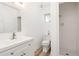 Bathroom featuring bright white tiles, sink, shower and toilet at 1701 Palmer Ave, Winter Park, FL 32789