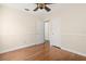 Bedroom features wood floors, neutral walls, and closet for storage at 1701 Palmer Ave, Winter Park, FL 32789