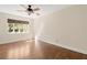 Cozy bedroom filled with natural light and hardwood flooring at 1701 Palmer Ave, Winter Park, FL 32789