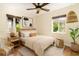 Cozy bedroom features neutral tones, natural light, wood accents, and stylish decor at 1701 Palmer Ave, Winter Park, FL 32789