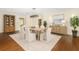 Elegant dining room is complete with stylish decor, a chandelier and seating for six at 1701 Palmer Ave, Winter Park, FL 32789