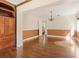 Living room features hardwood floors, neutral paint, and elegant chandelier at 1701 Palmer Ave, Winter Park, FL 32789