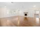 Bright and airy living room showcasing hardwood floors and a cozy fireplace at 1701 Palmer Ave, Winter Park, FL 32789