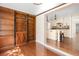 Spacious living room boasts hardwood floors and a stylish built-in bookshelf at 1701 Palmer Ave, Winter Park, FL 32789