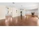 Expansive living area with hardwood floors, modern lighting, and fireplace at 1701 Palmer Ave, Winter Park, FL 32789